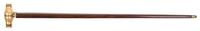 A French Gilt Metal and Mother-of-Pearl Monocular Mounted Cane, Height overall 36 3/8 x width of handle 4 1/2 inches.