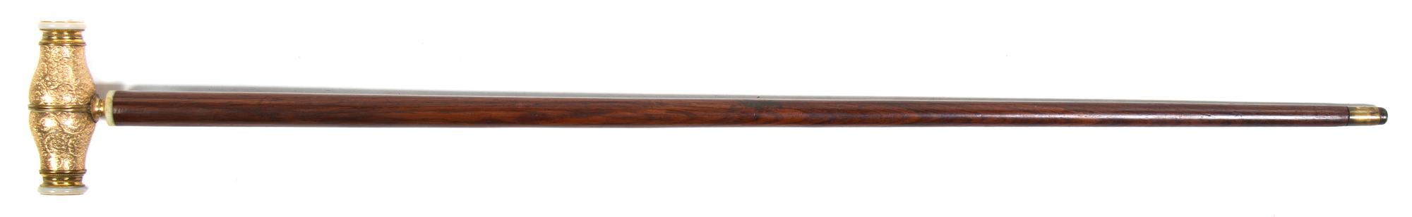 A French Gilt Metal and Mother-of-Pearl Monocular Mounted Cane, Height overall 36 3/8 x width of handle 4 1/2 inches.