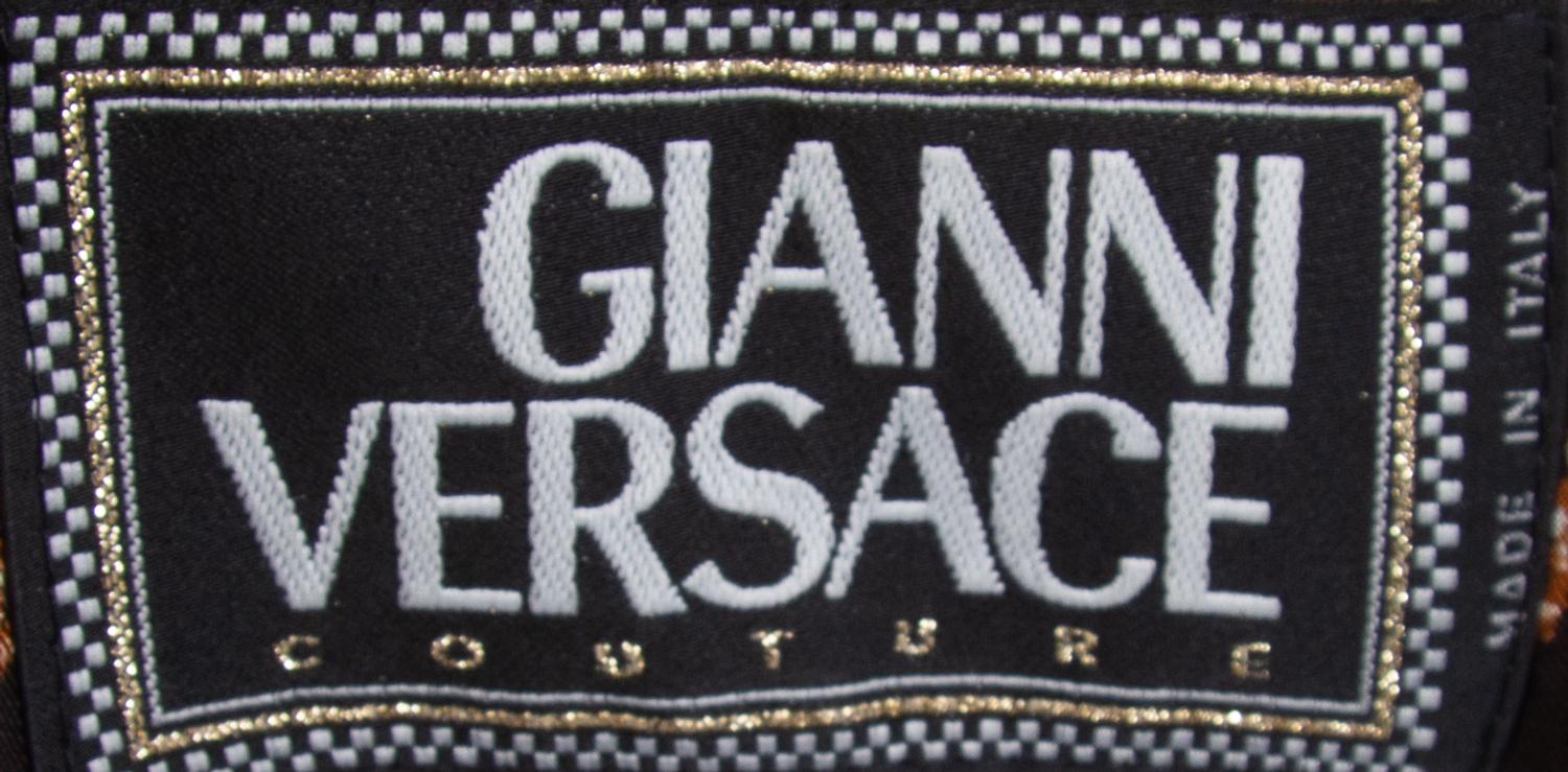 A Gianni Versace Animal Print Ensemble, Jacket and vest size 4, leggings size 42.