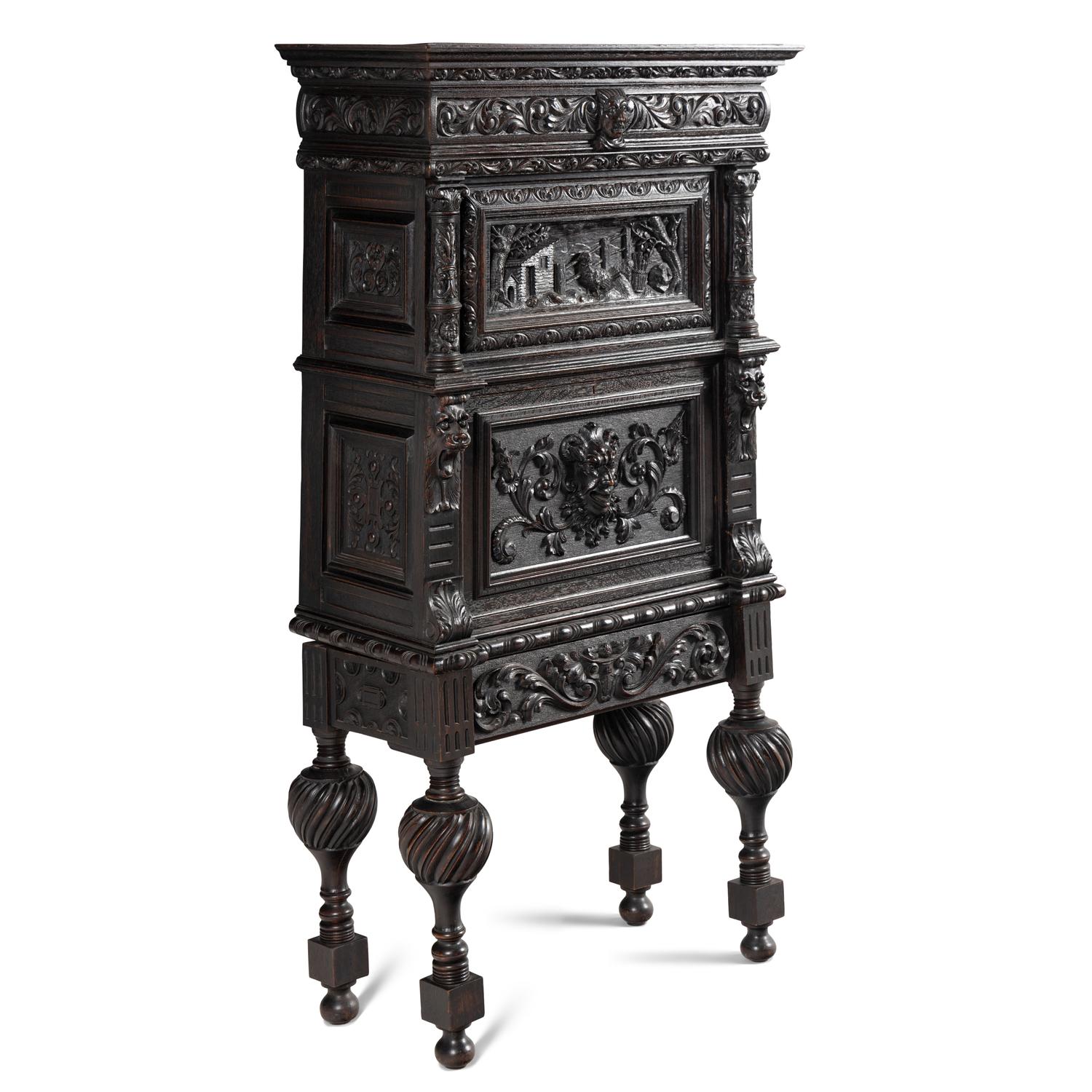 An Italian Renaissance Revival Carved Oak Bureau Cabinet on Stand