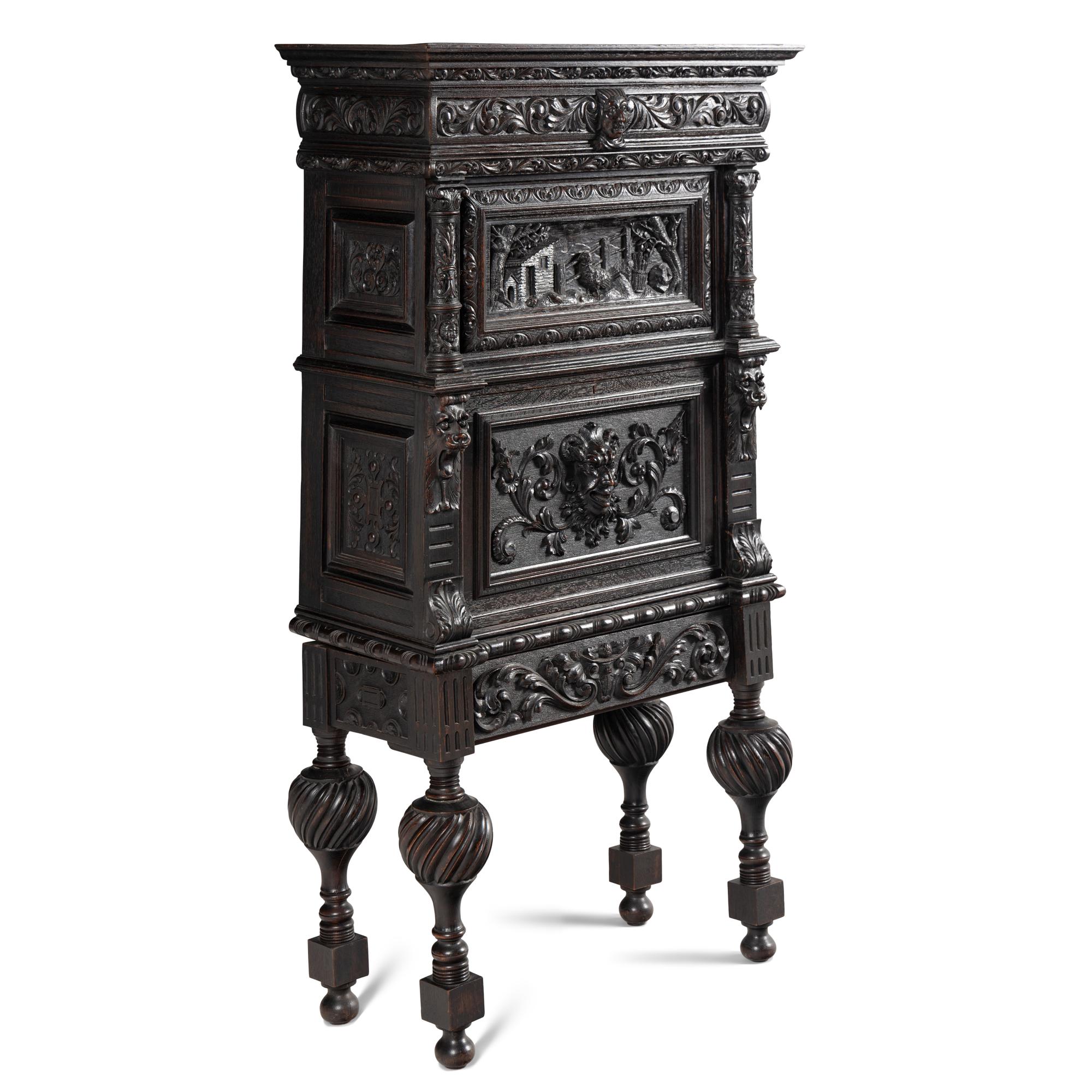 An Italian Renaissance Revival Carved Oak Bureau Cabinet on Stand
