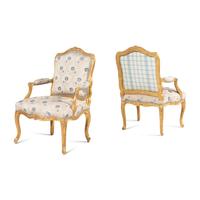 A Pair of Louis XV Carved and Giltwood Fauteuils à la Reine