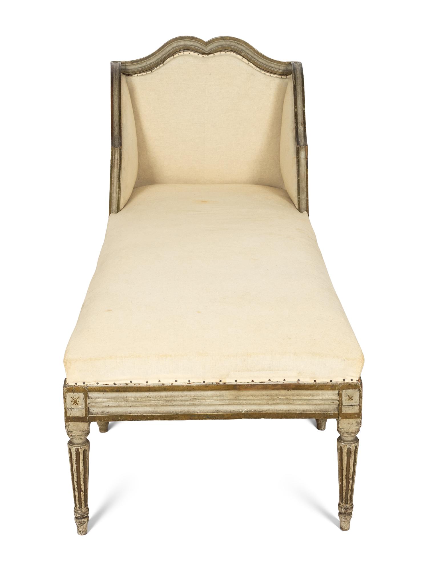 A Louis XVI Painted and Parcel Gilt Chaise Longue