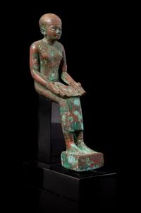 An Egyptian Bronze Seated Imhotep Height 5 1/2 inches. — LATE PERIOD TO PTOLEMAIC PERIOD, 664-30 B.C.E.