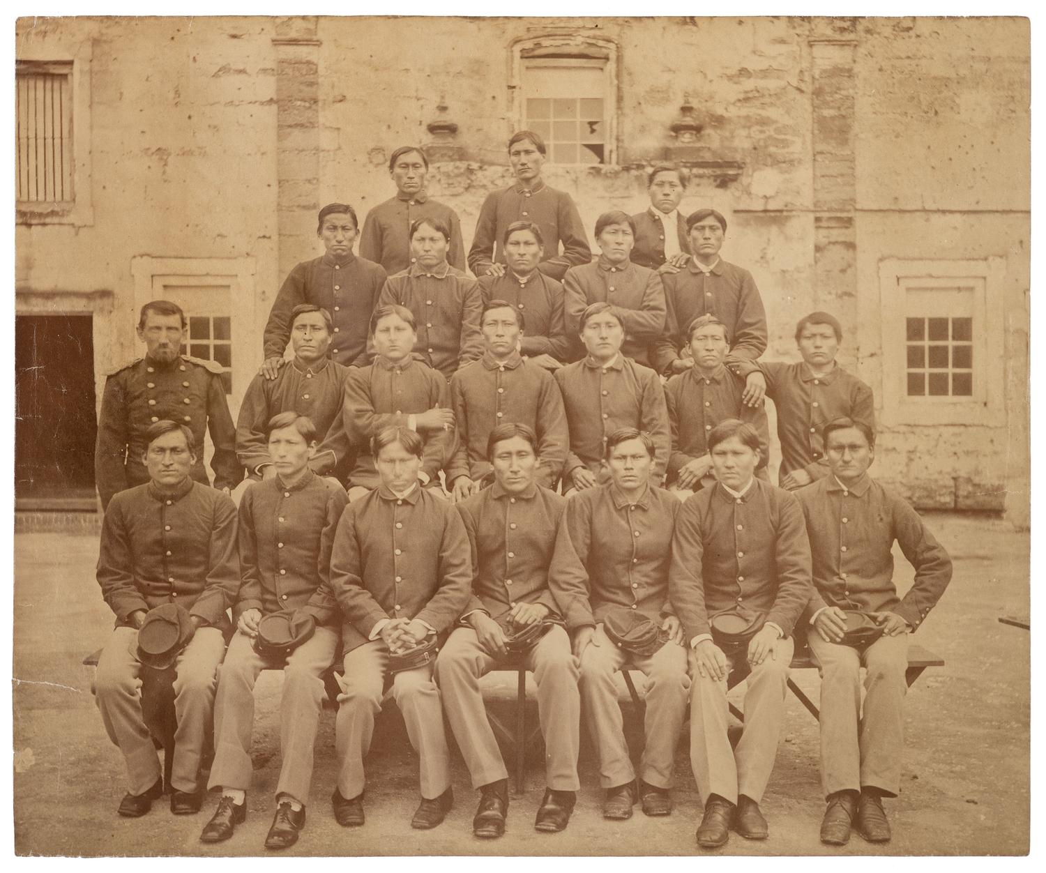 [NATIVE AMERICANS]. Large format photograph of Captain R.H. Pratt with Kiowa and Southern Cheyenne prisoners at Fort Marion. Ca 1878.