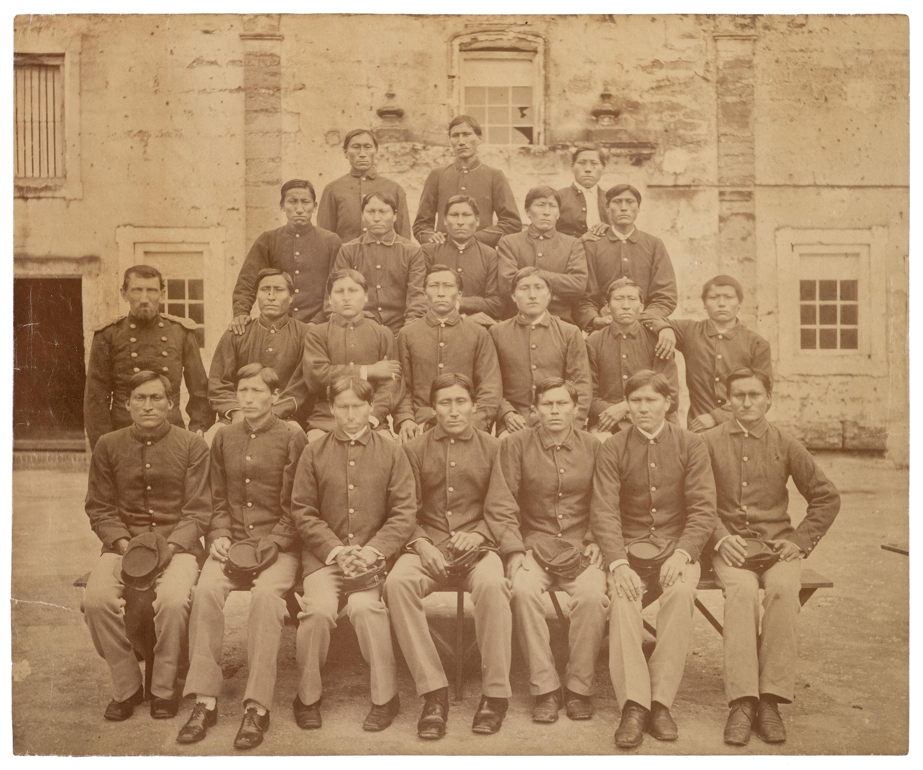 [NATIVE AMERICANS]. Large format photograph of Captain R.H. Pratt with Kiowa and Southern Cheyenne prisoners at Fort Marion. Ca 1878.