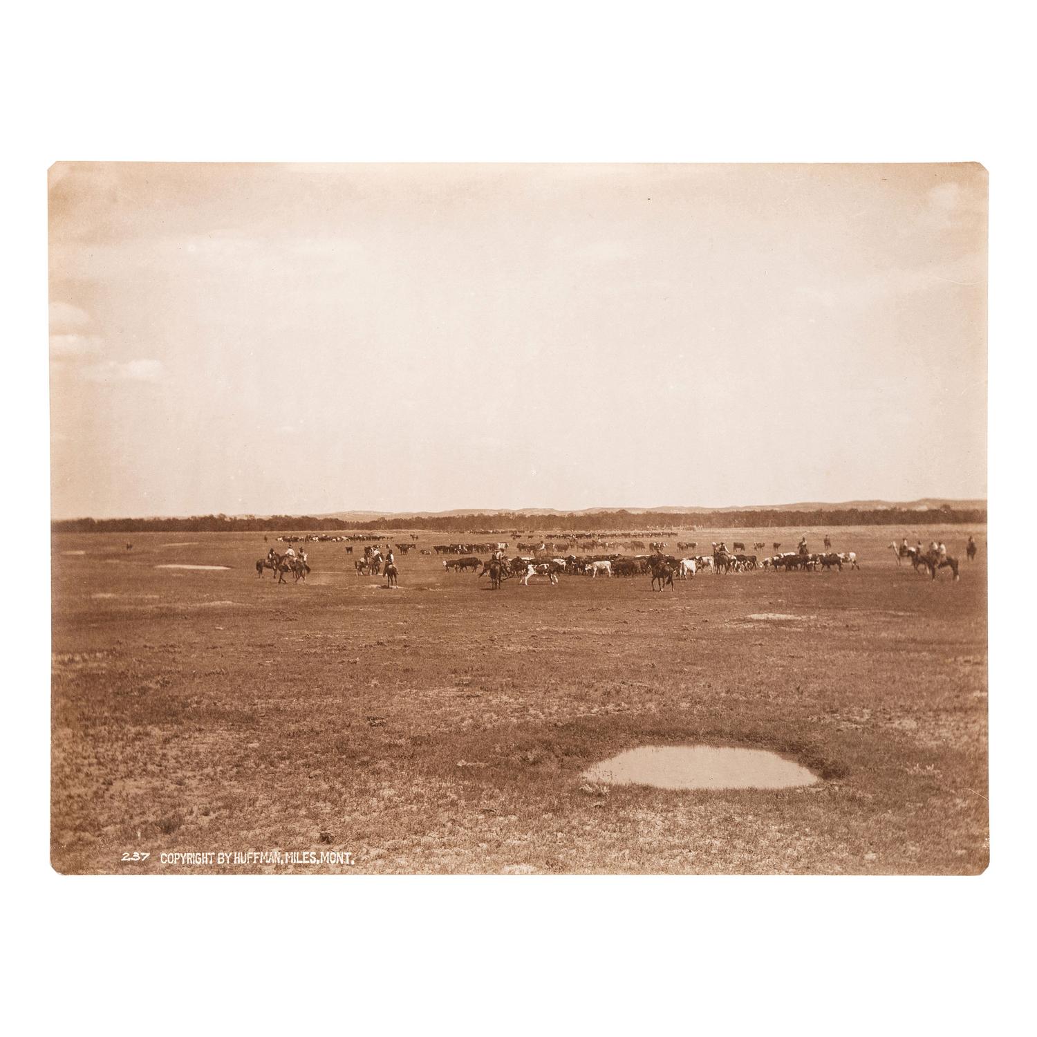HUFFMAN, Laton Alton (1854-1931). Outdoor portrait of a cowboy on horseback. Miles, MT: Huffman, [ca 1880s].