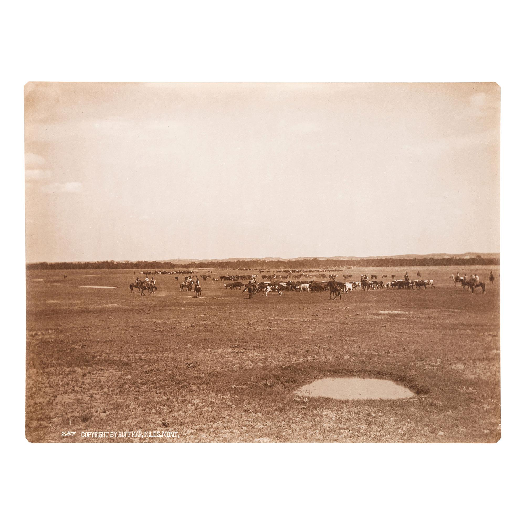 HUFFMAN, Laton Alton (1854-1931). Outdoor portrait of a cowboy on horseback. Miles, MT: Huffman, [ca 1880s].