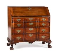 A Chippendale Carved and Figured Mahogany Block-Front Slant-Front Desk