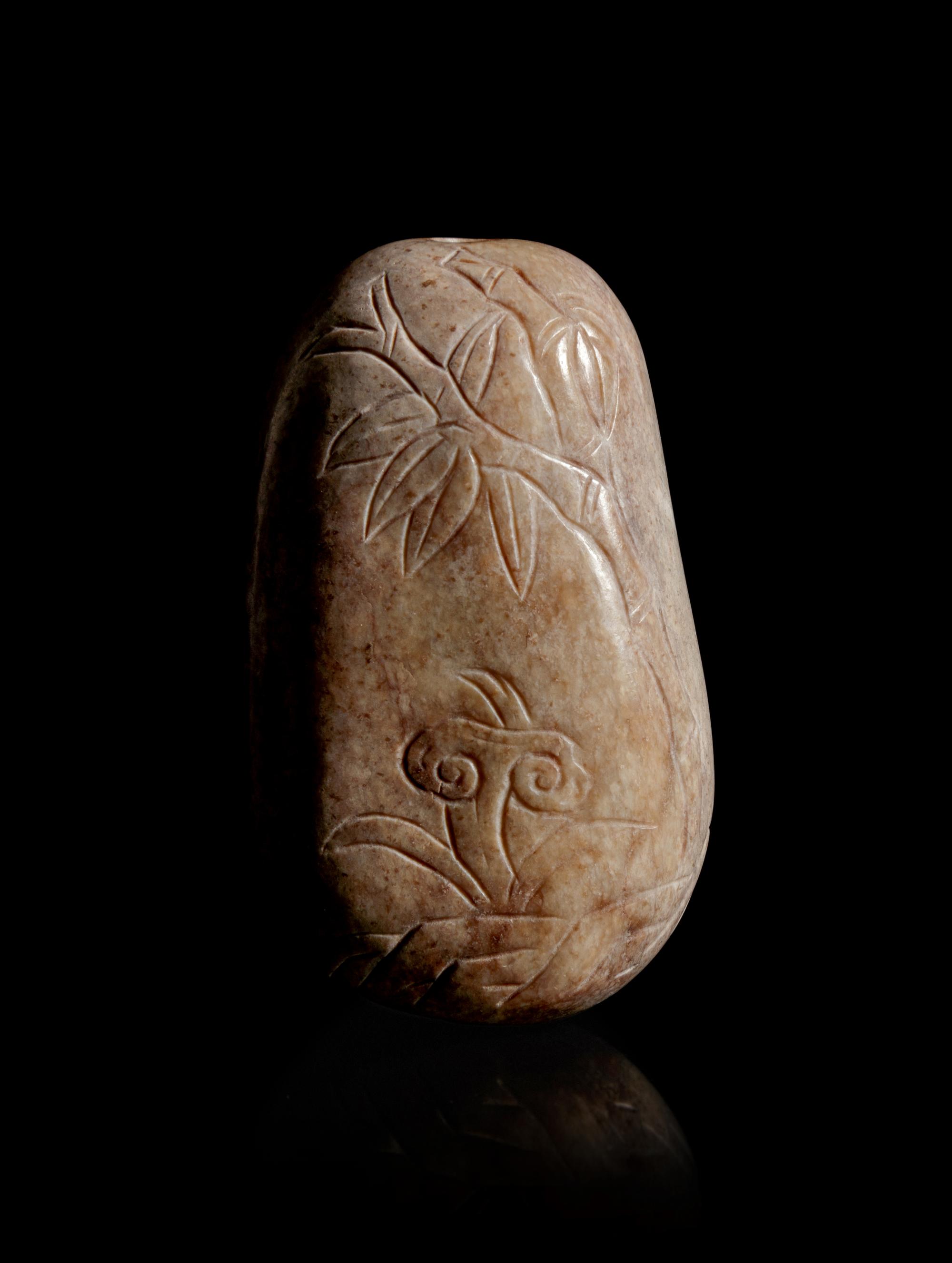 A Burned Jade Pebble-Form Snuff Bottle