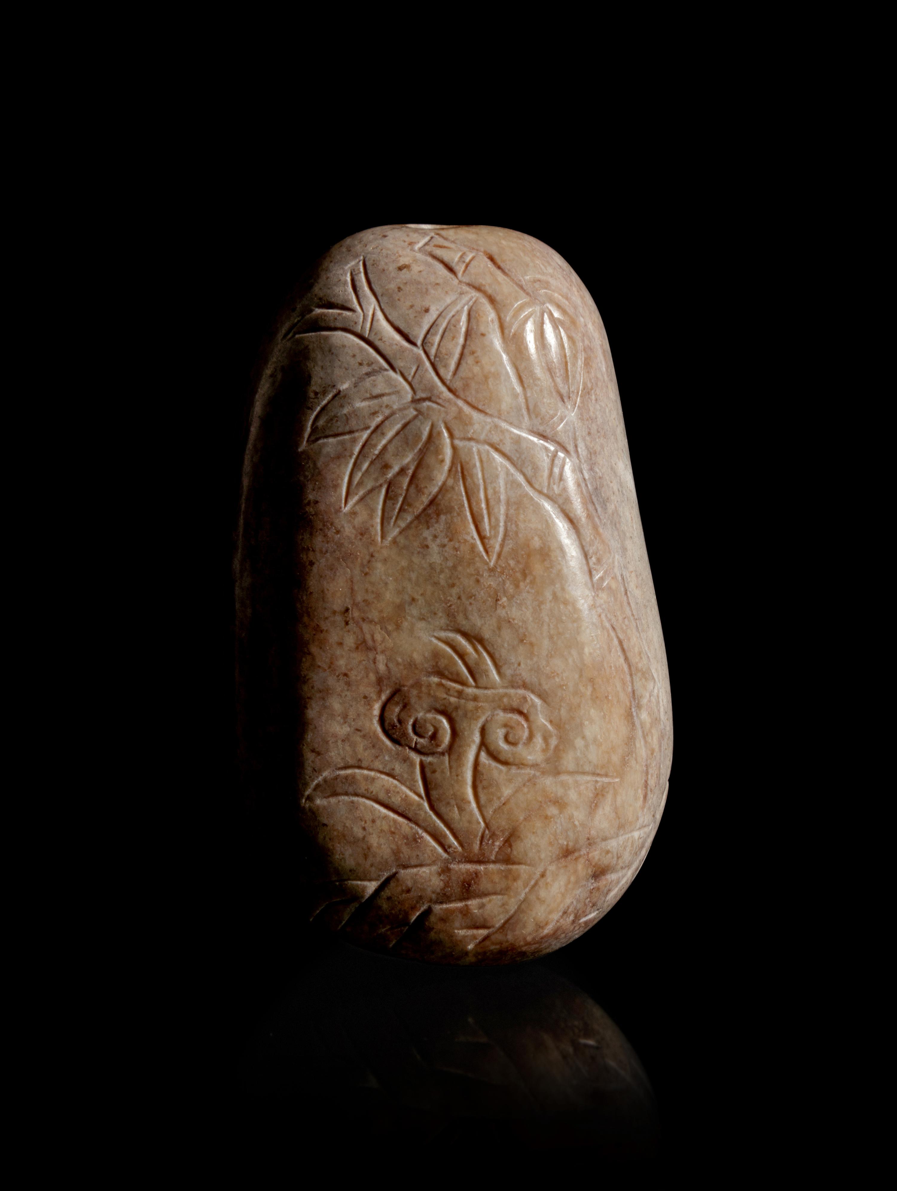 A Burned Jade Pebble-Form Snuff Bottle