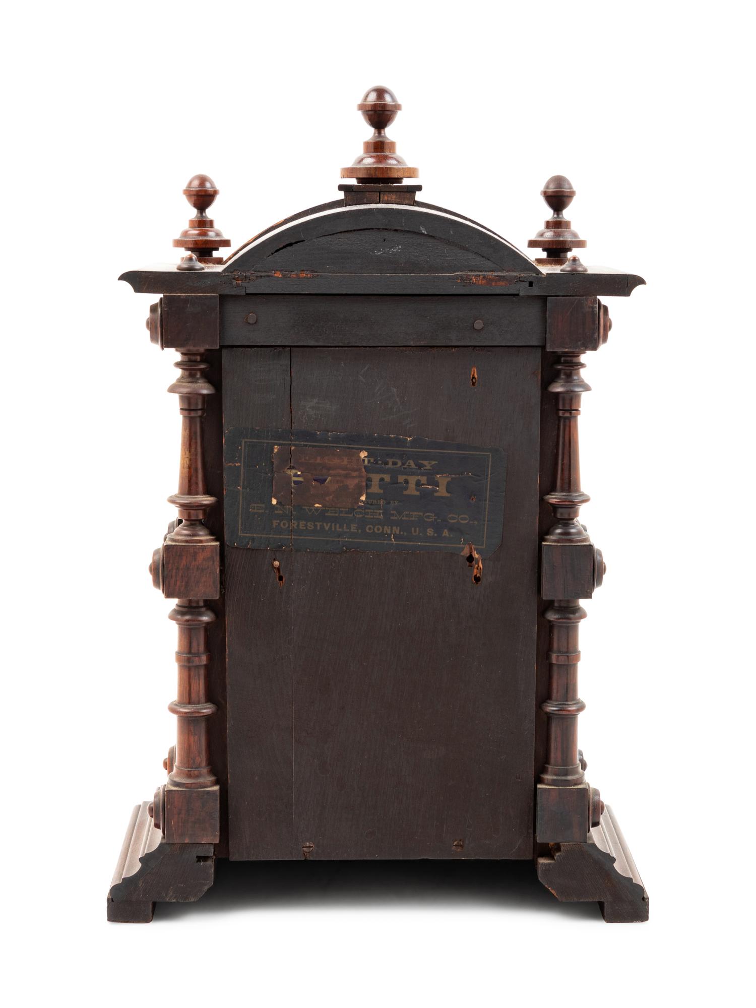 A Victorian Walnut Mantel Clock