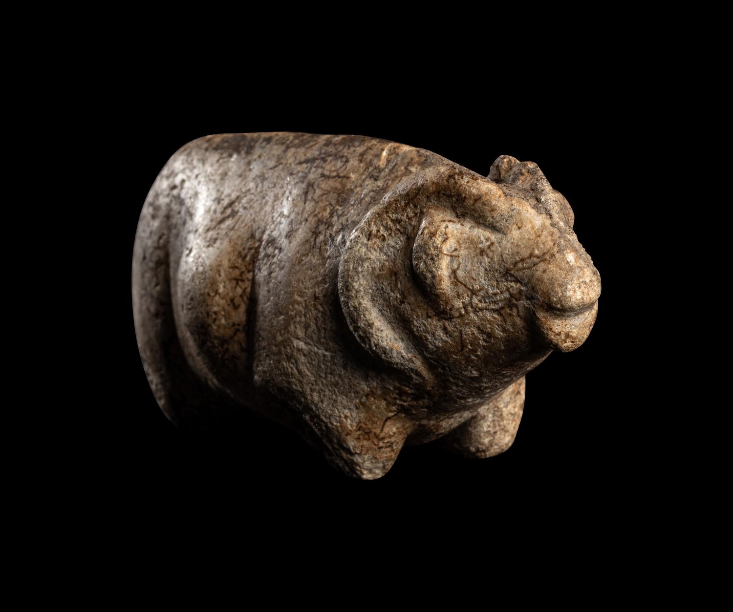 A Near Eastern Marble Figure of a Pregnant Mouflon