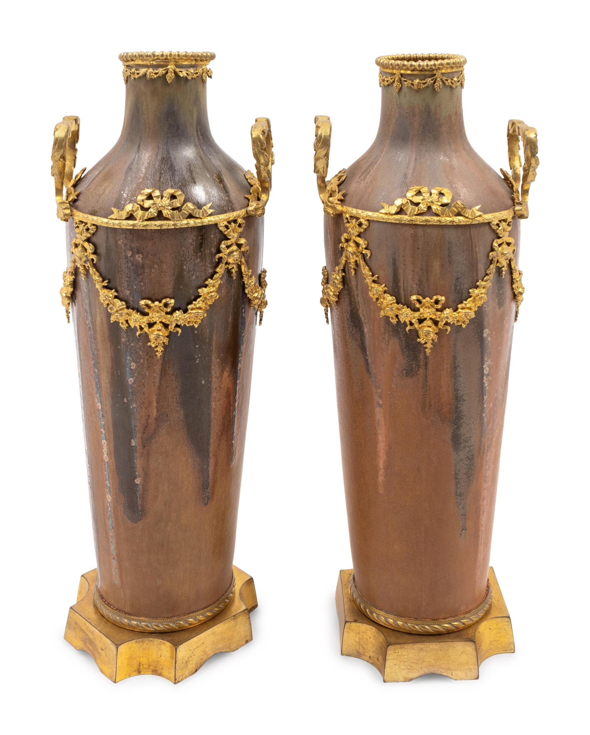 A Pair of Louis XVI Style Gilt-Metal-Mounted Pottery Vases
