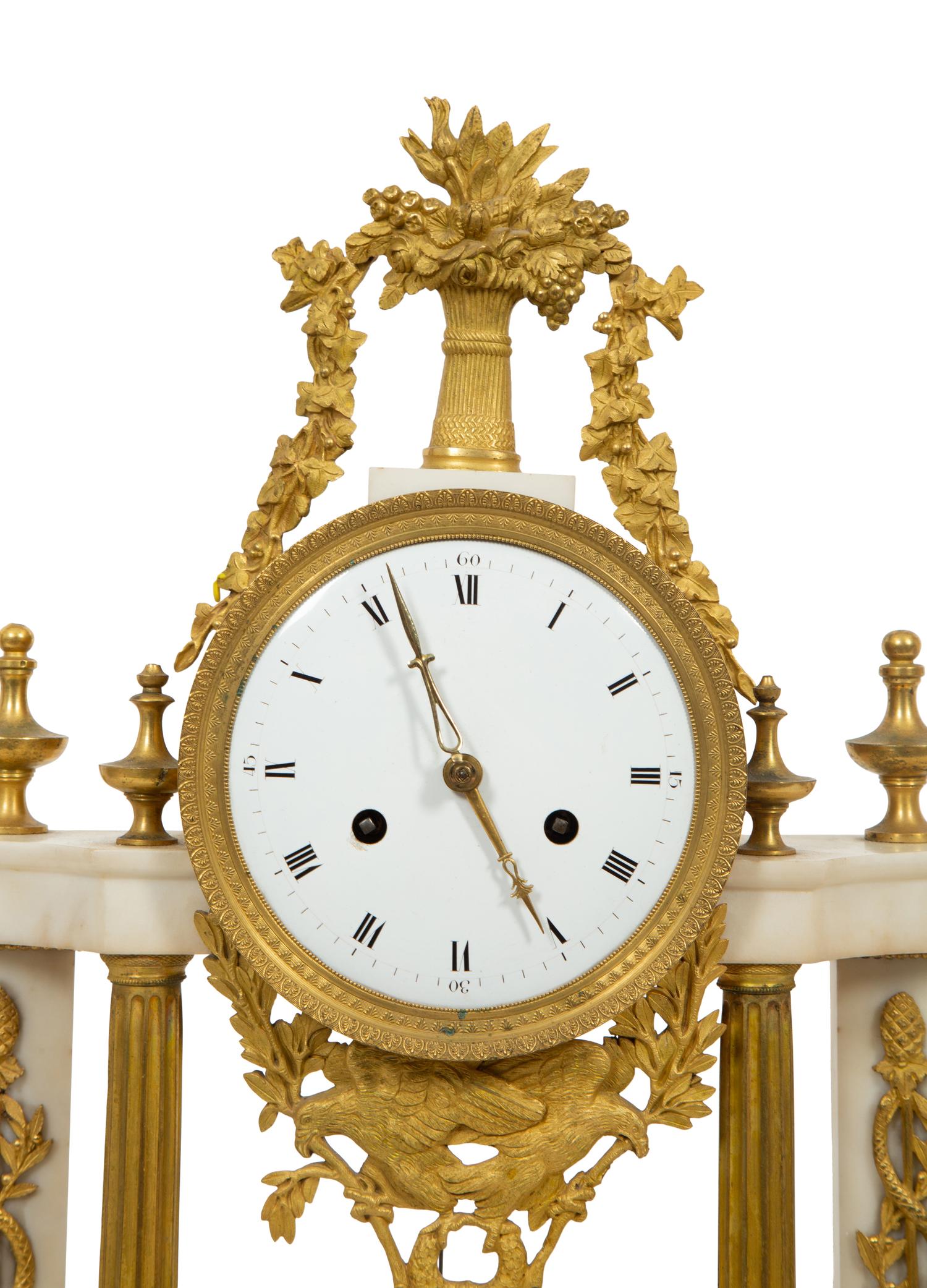 A French Gilt Bronze and White Marble Mantel Clock