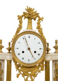 A French Gilt Bronze and White Marble Mantel Clock