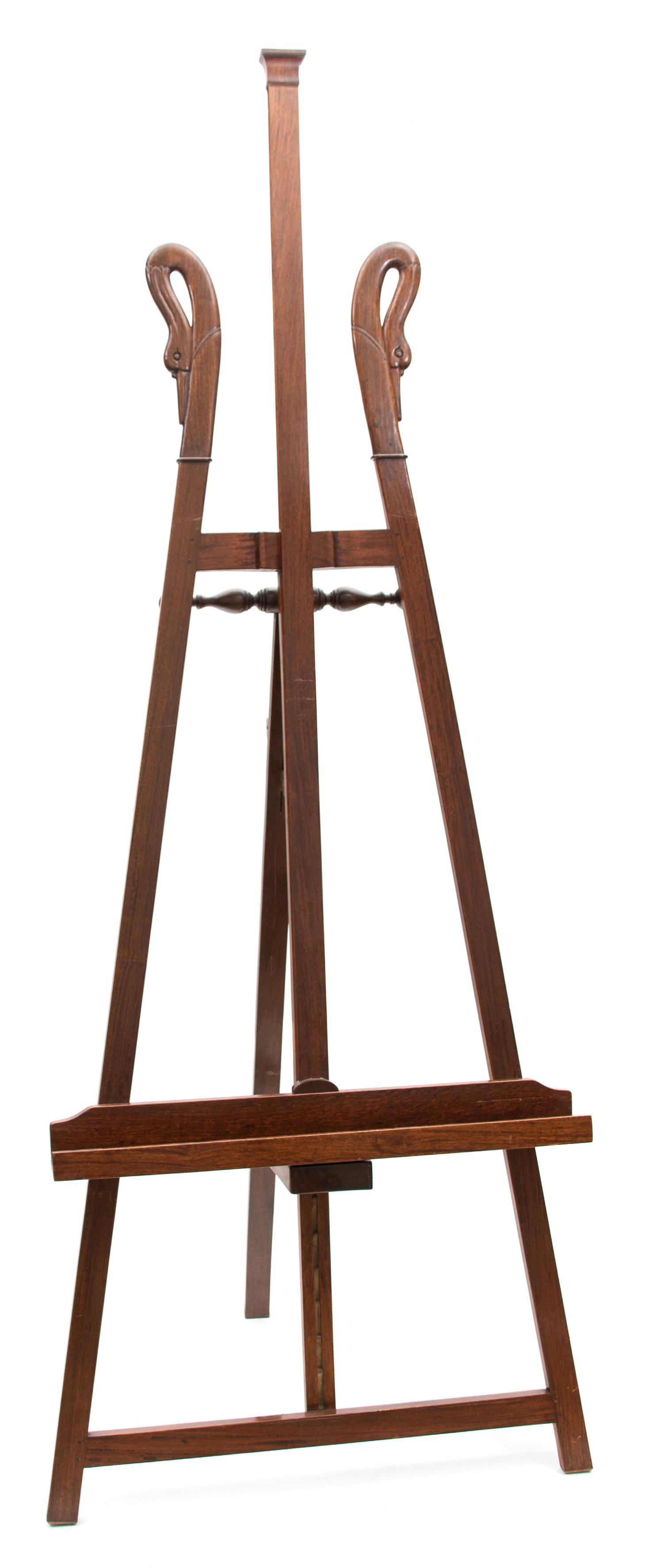 An English Carved Mahogany Swan's Neck Easel Height 81 x width 29 1/2 inches.