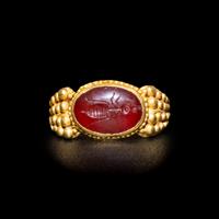 A Late Roman Gold and Carnelian Ring with an Ant Carrying an Ear of Wheat