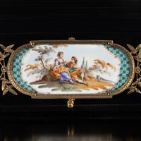 A German Ebonized and Porcelain Mounted Bureau