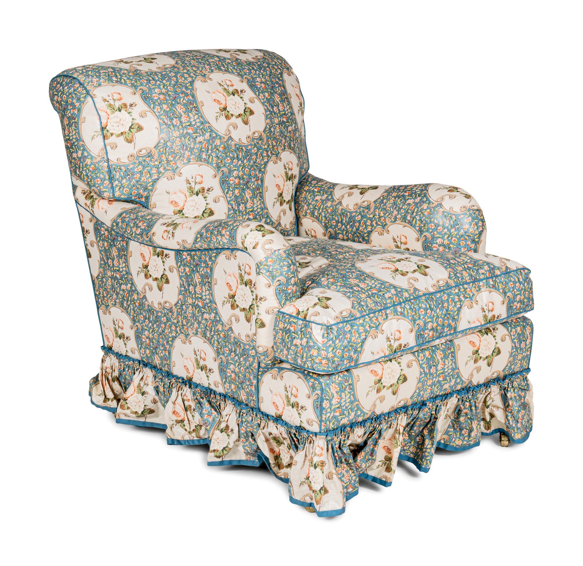 An English Chintz-Upholstered Easy Chair and Ottoman