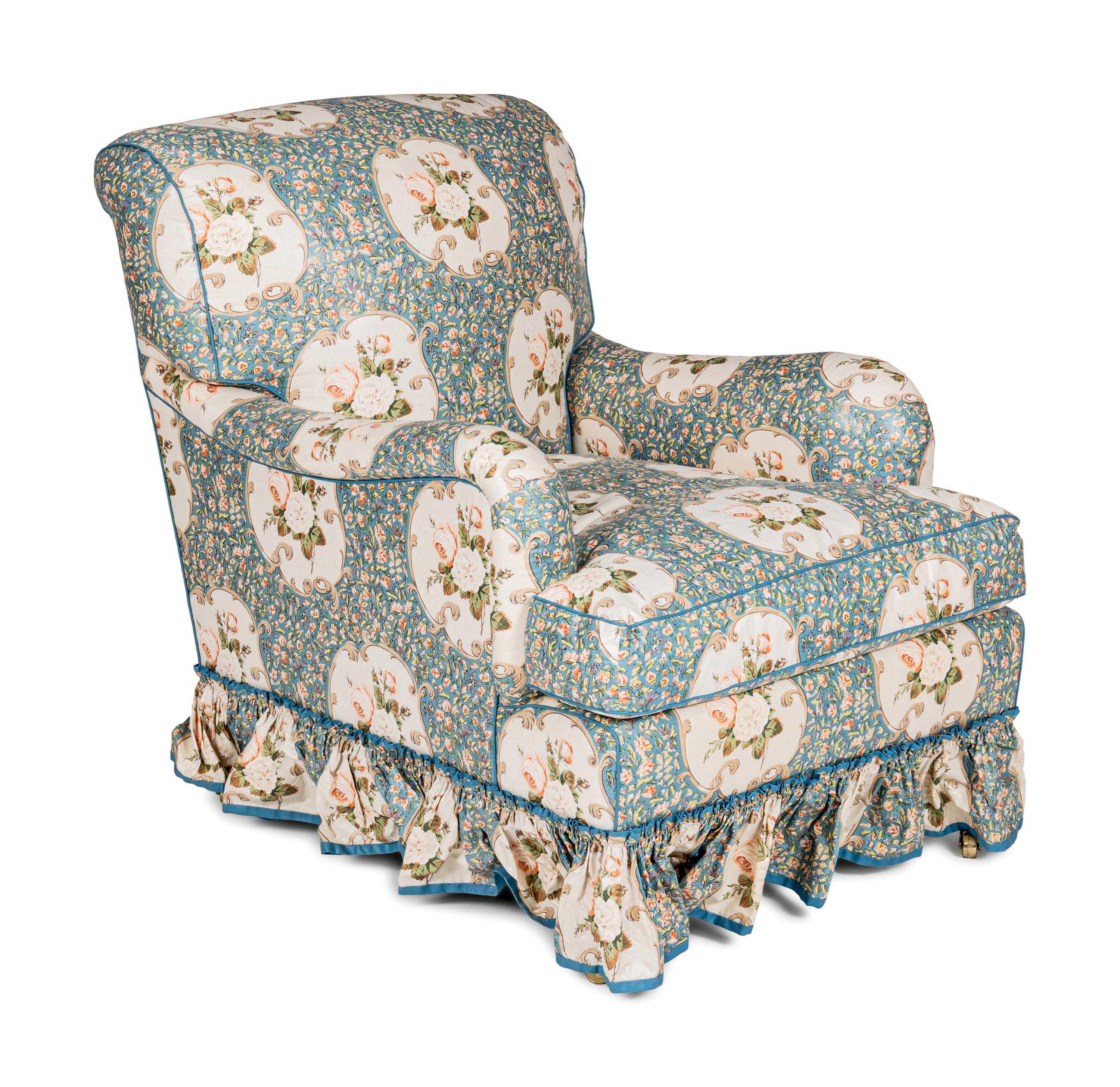 An English Chintz-Upholstered Easy Chair and Ottoman