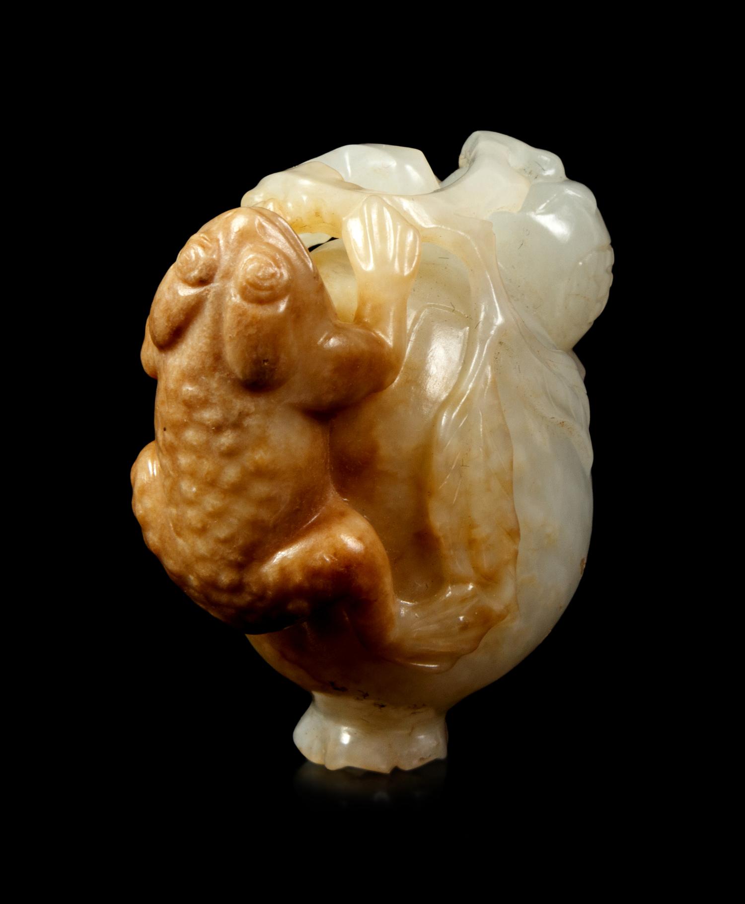A White and Russet Jade Group of a Frog on a Pomegranate