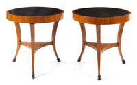 A Pair of Italian Neoclassical Parcel Ebonized Fruitwood Tables Height 32 x diameter of top 32 inches. — CIRCA 1820