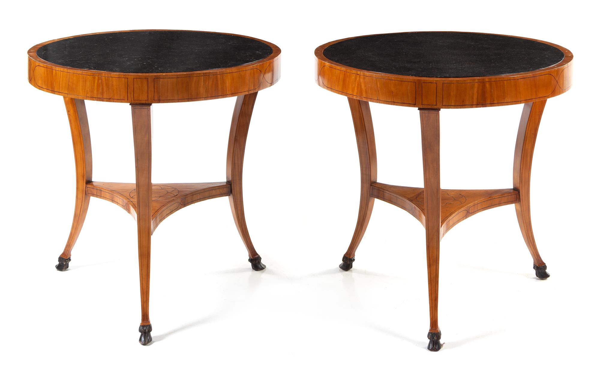 A Pair of Italian Neoclassical Parcel Ebonized Fruitwood Tables Height 32 x diameter of top 32 inches. — CIRCA 1820