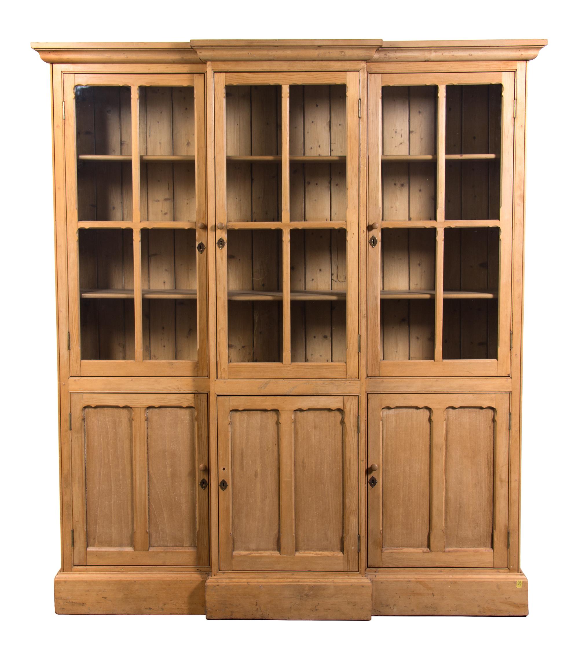 A Georgian Style Pine Breakfront Bookcase Height 85 x width 69 1/2 x depth 13 1/4 inches. — 20TH CENTURY