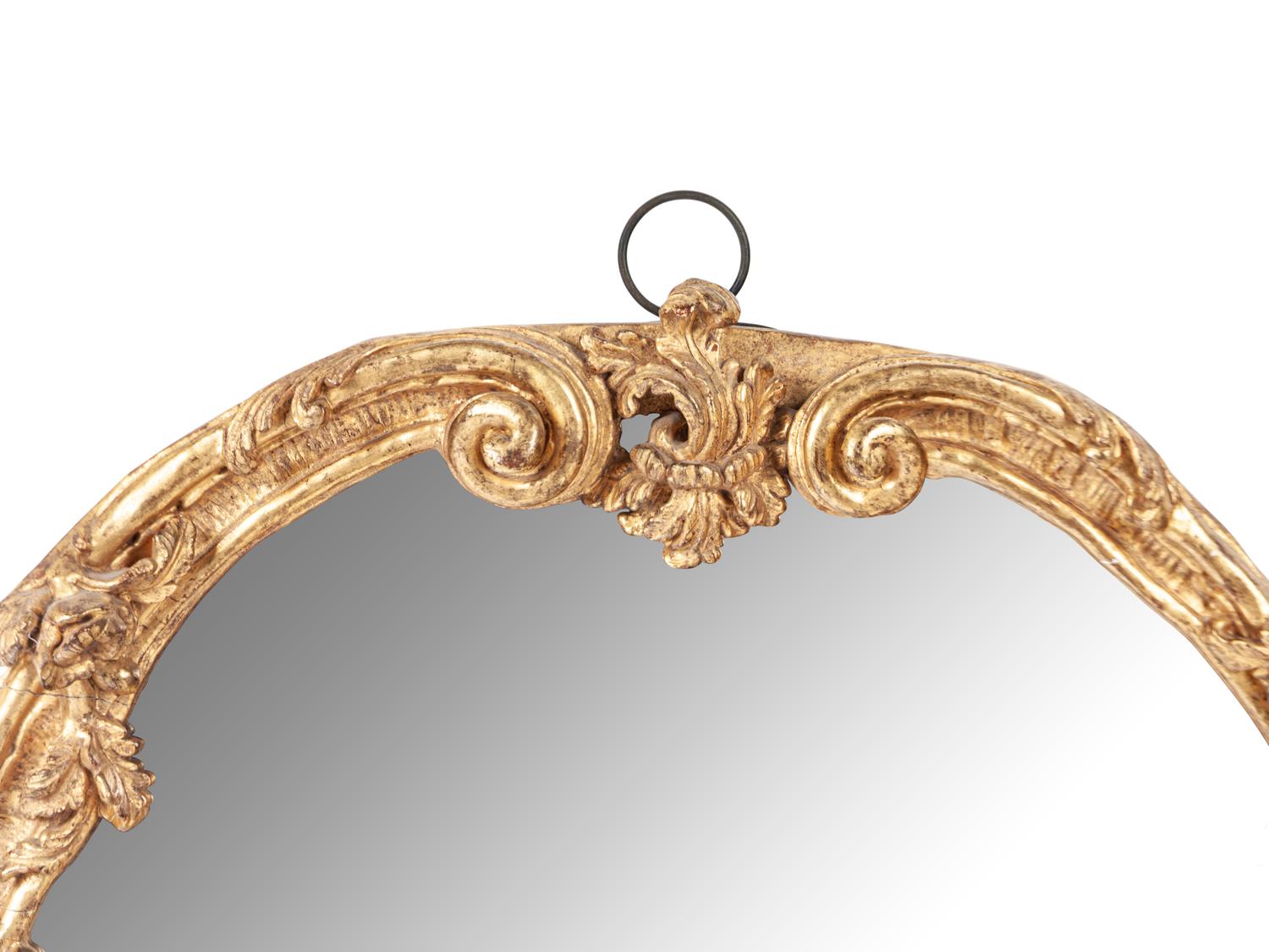 A Rococo Style Carved Giltwood Mirror