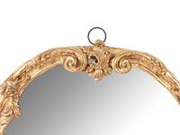 A Rococo Style Carved Giltwood Mirror