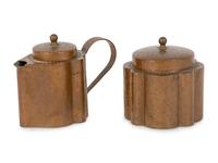 A Joseph Heinrichs Hammered Copper on Silver Creamer and Sugar