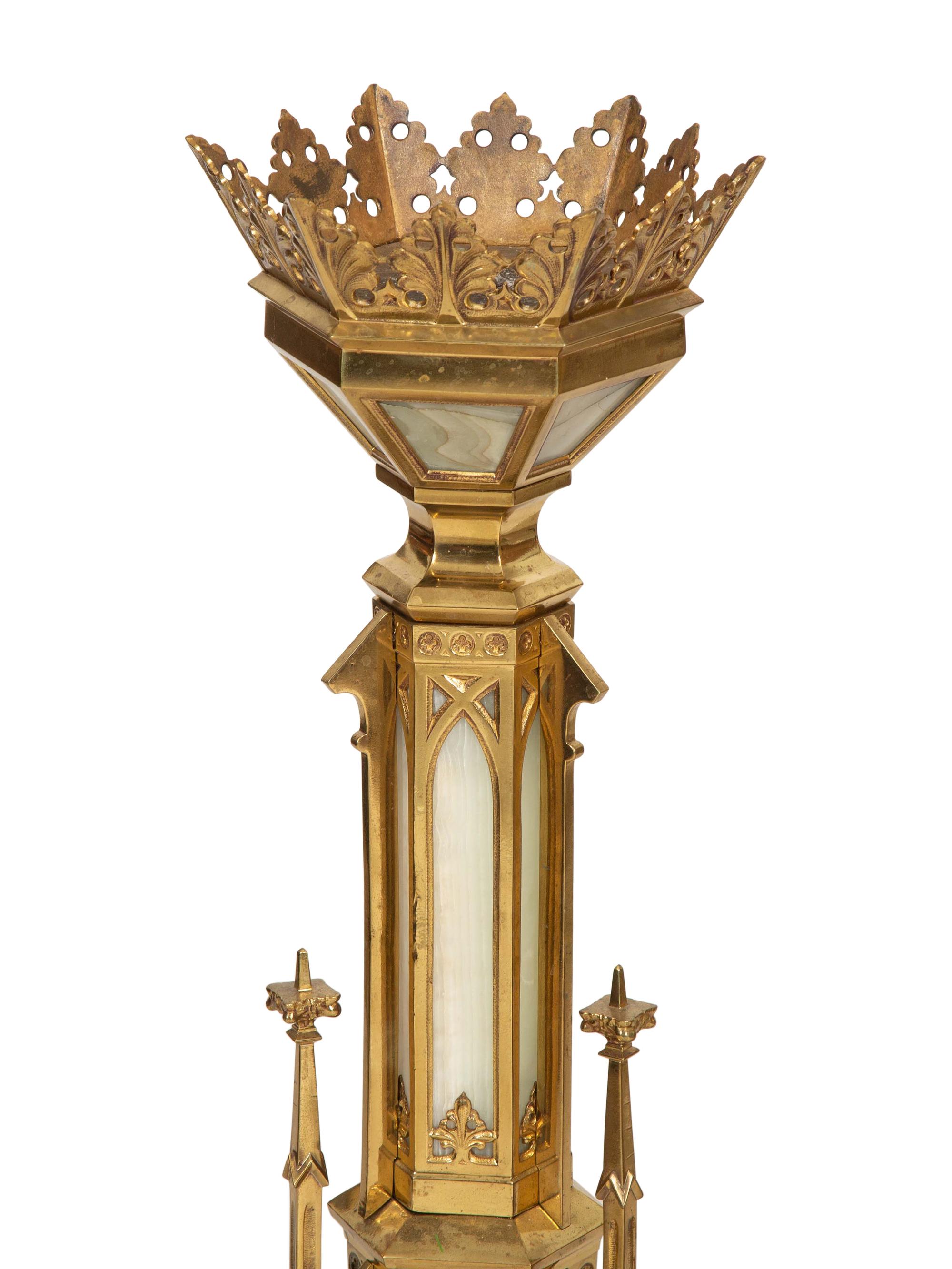 A Pair of Gothic Style Brass and Inset Glass Candlesticks