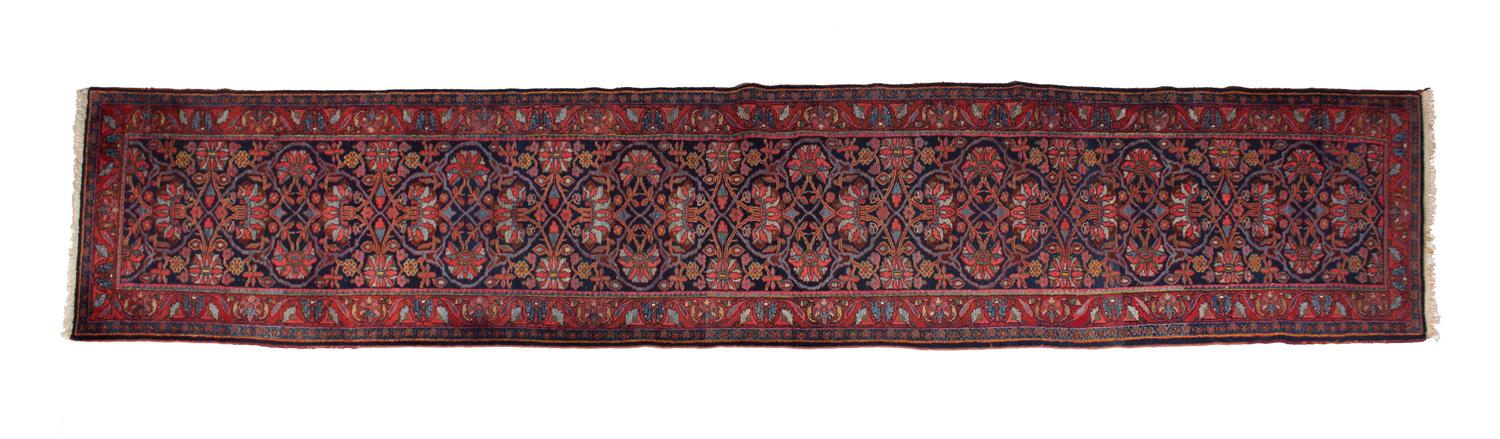 A Persian Wool Runner 17 feet 4 x 3 feet 6 inches. — 20TH CENTURY
