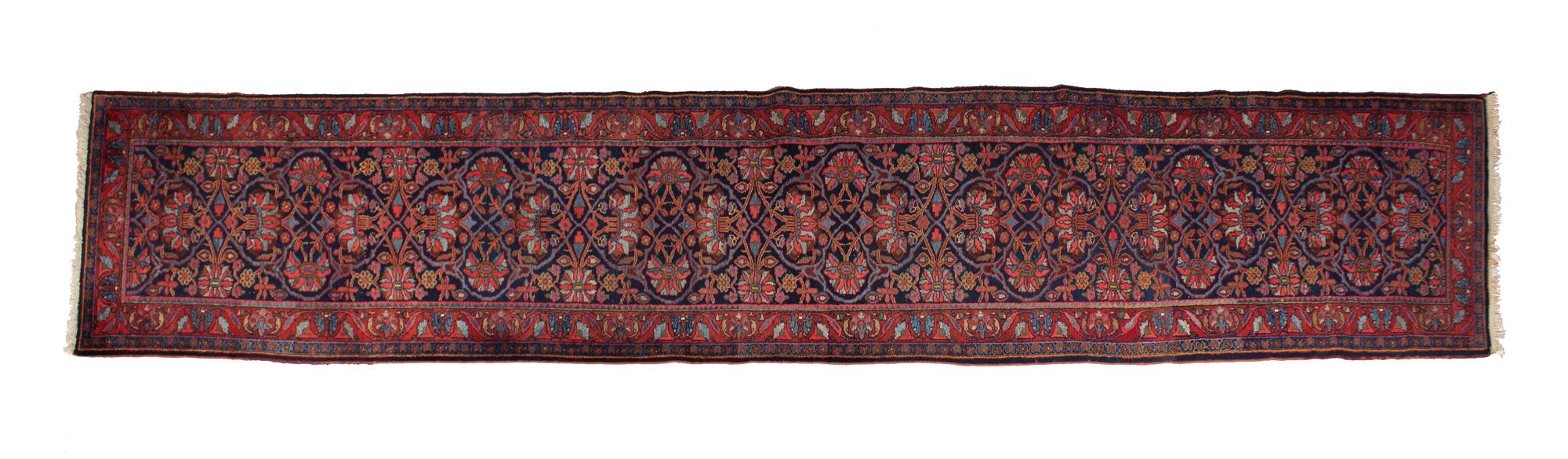 A Persian Wool Runner 17 feet 4 x 3 feet 6 inches. — 20TH CENTURY