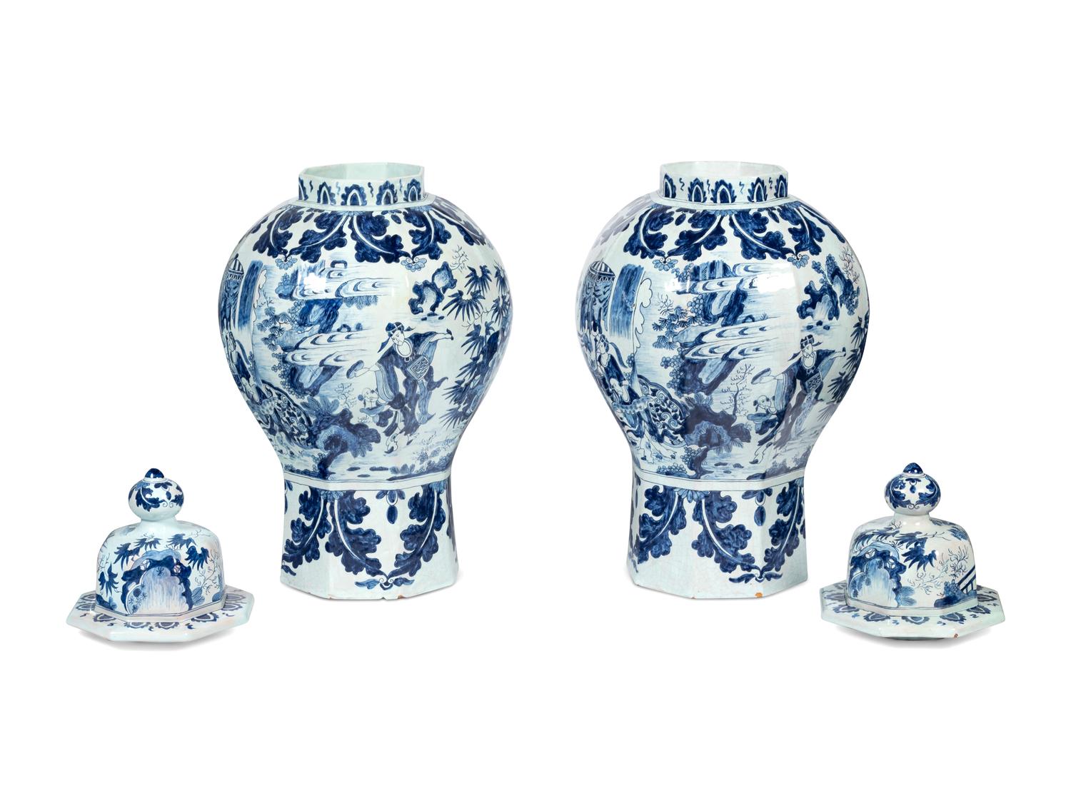 A Pair of Delftware Vases and Covers
