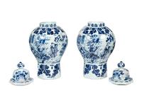 A Pair of Delftware Vases and Covers