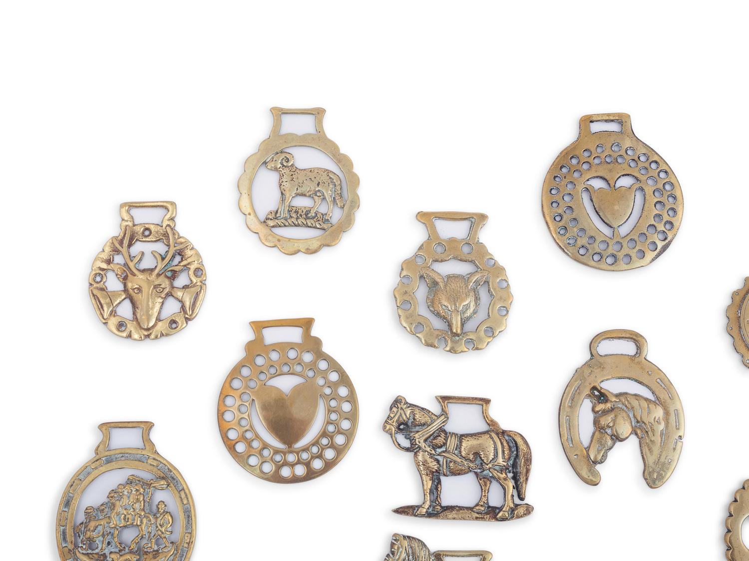 A Collection of Twenty Five Pressed and Cast Brass Buckles