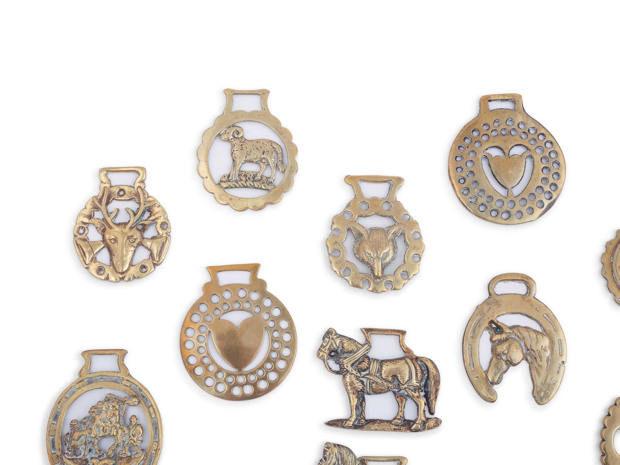 A Collection of Twenty Five Pressed and Cast Brass Buckles