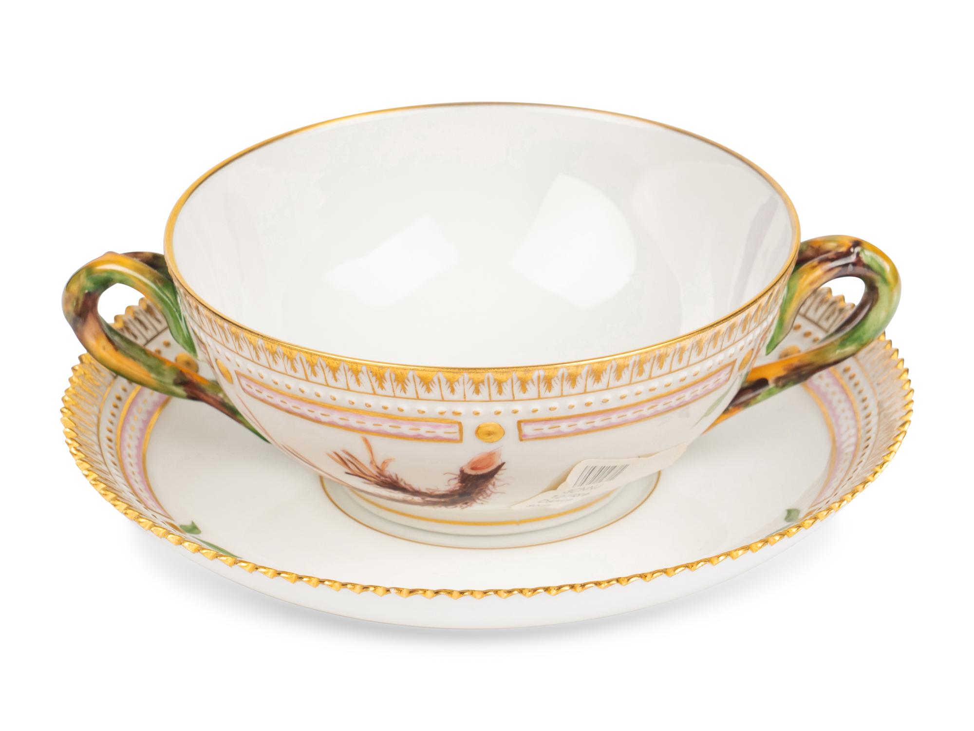 A Set of Twelve Royal Copenhagen Flora Danica Porcelain Bouillon Cups and Stands