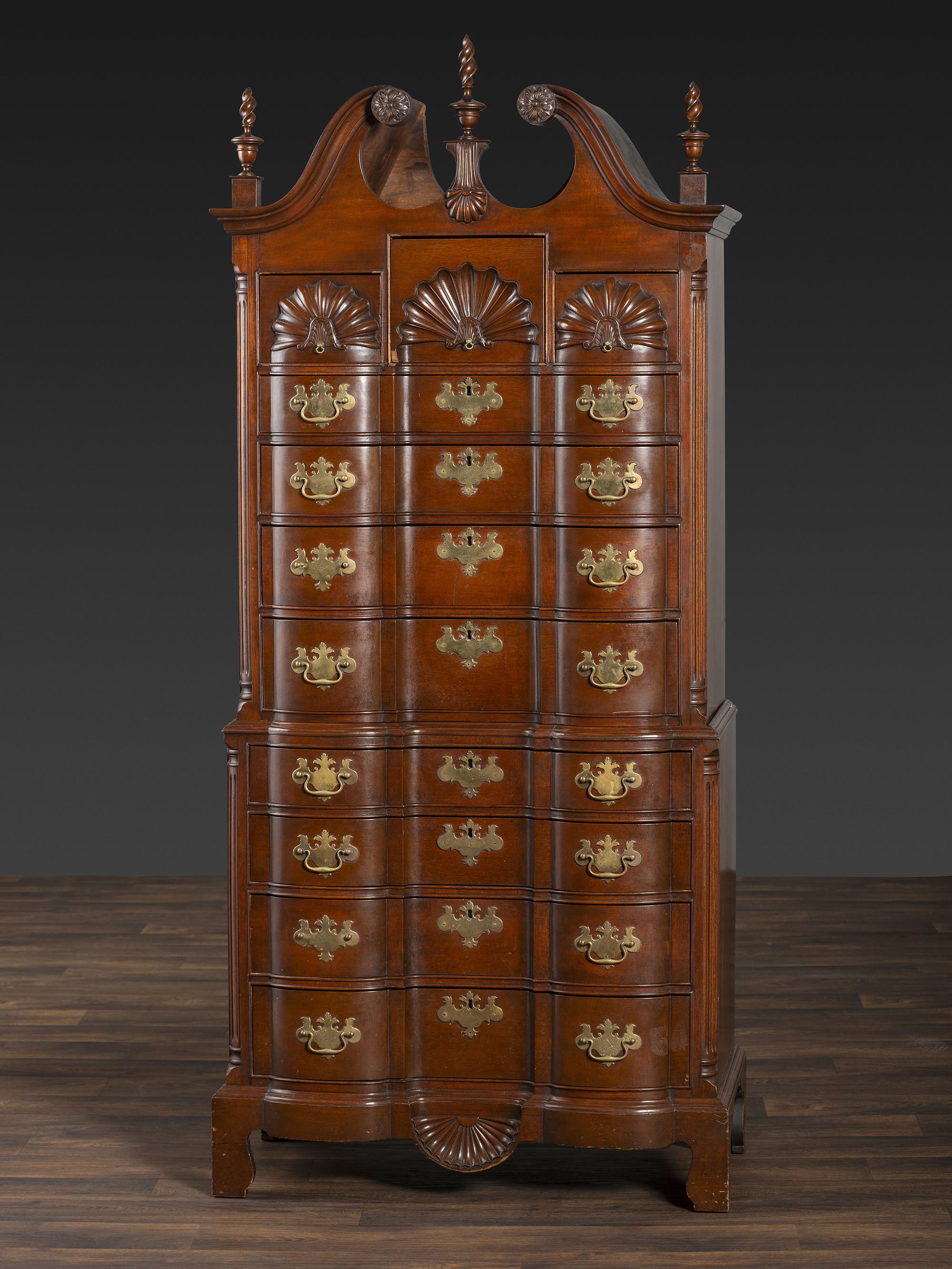 A Chippendale Style Shell and Rosette Carved Mahogany Block Front Chest-On-Chest