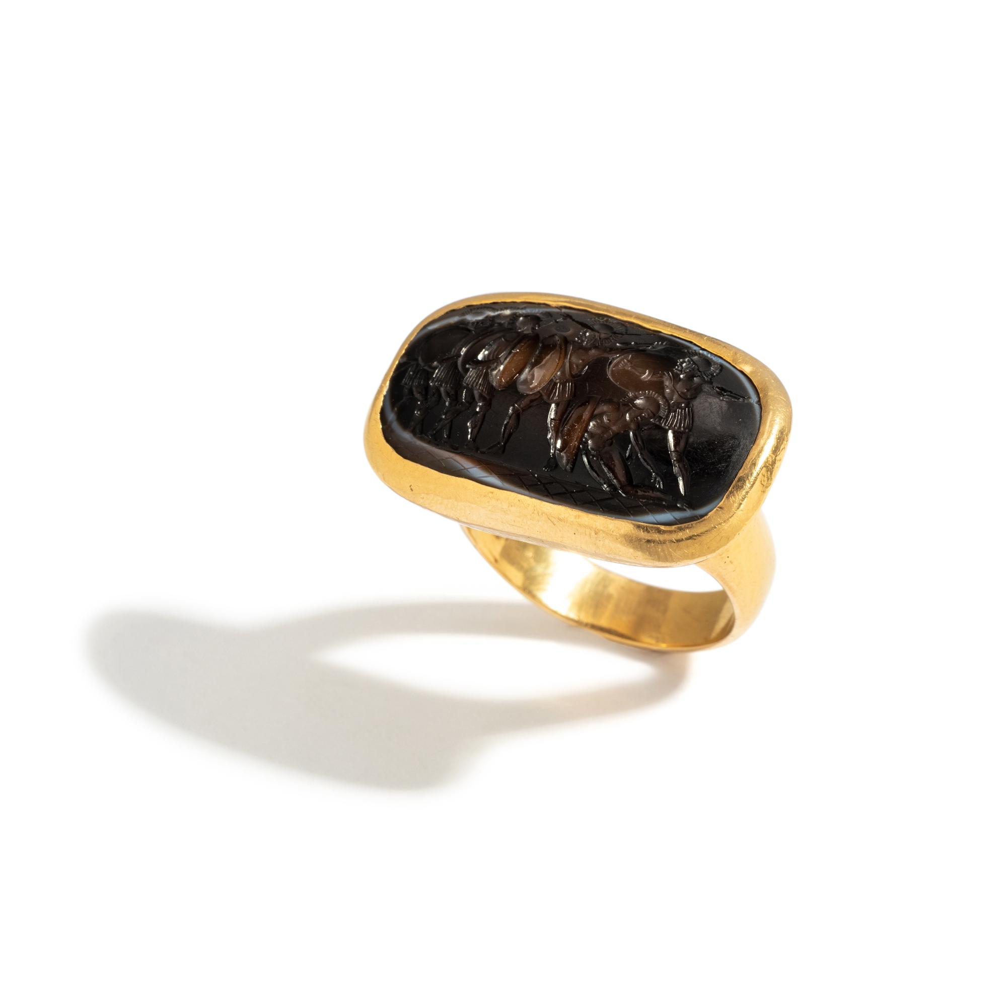A Roman Agate Ring Stone with Six Hoplites Battling — Set in a gold ring