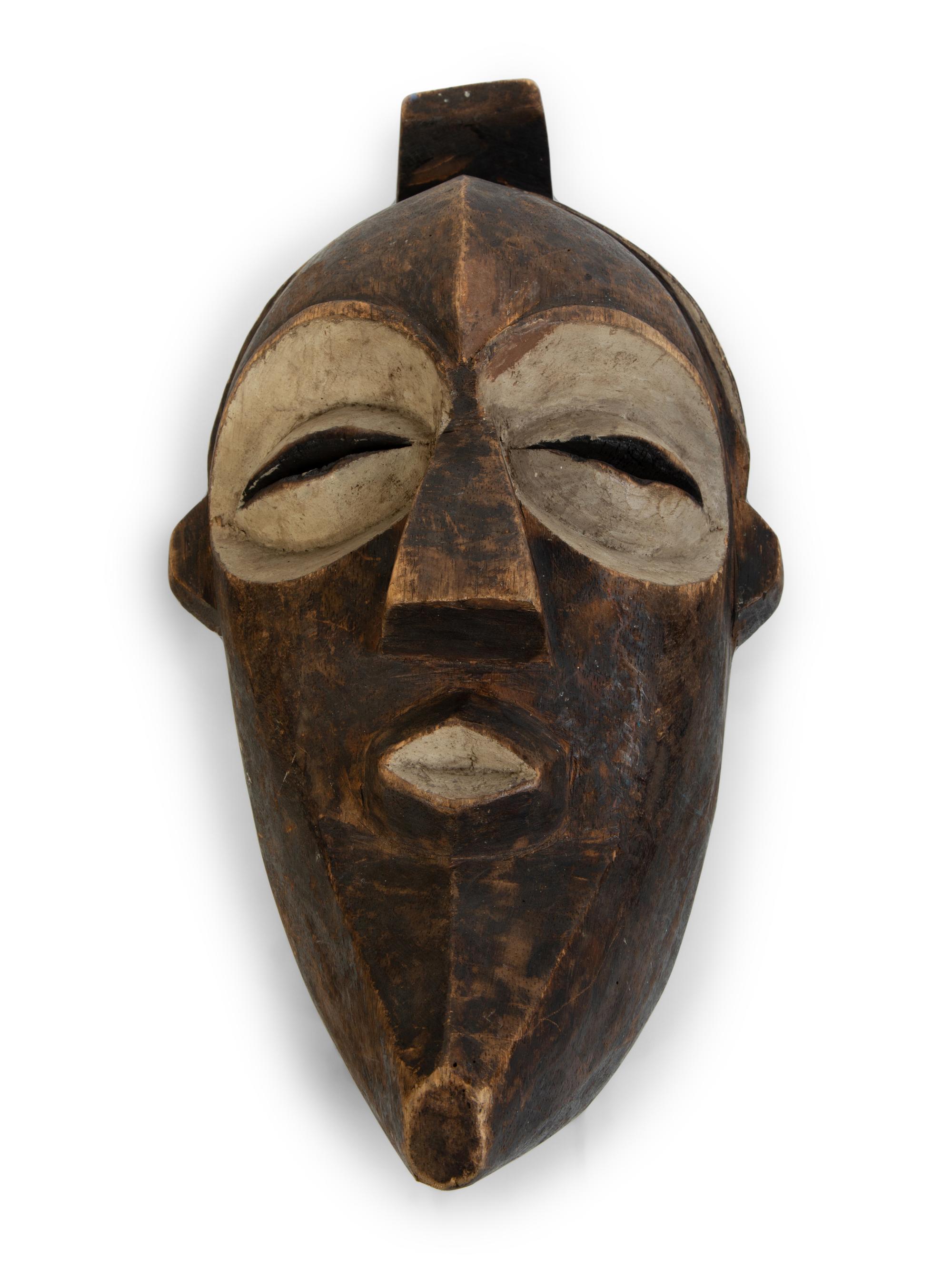 A Group of Three African Tribal Face Masks — 20TH CENTURY