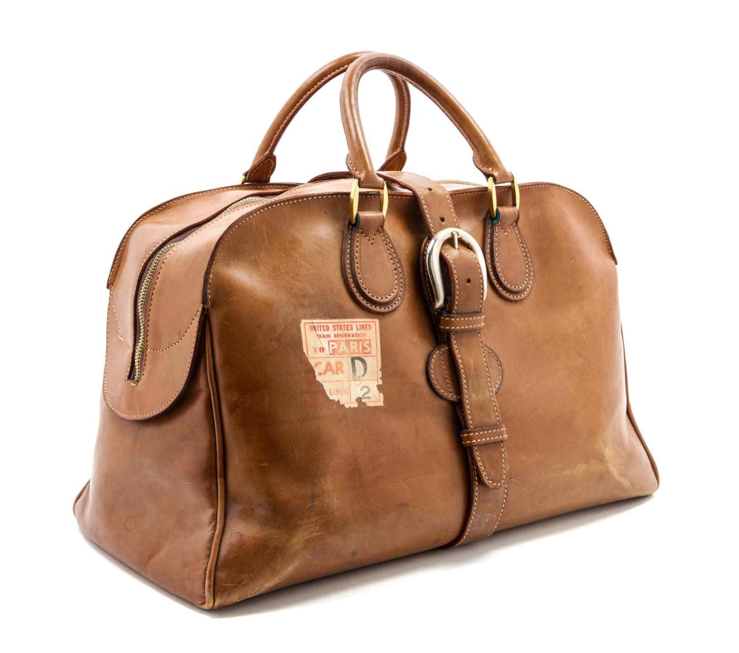 A Gucci Leather Travel Bag, 19 x 10 x 9 1/2 inches.