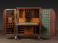 A Carved Walnut Wooton Secretary Desk