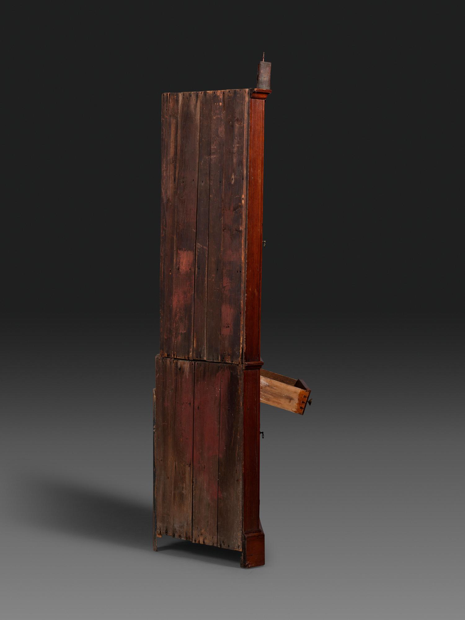 A Late Chippendale Carved Cherrywood Corner Cupboard