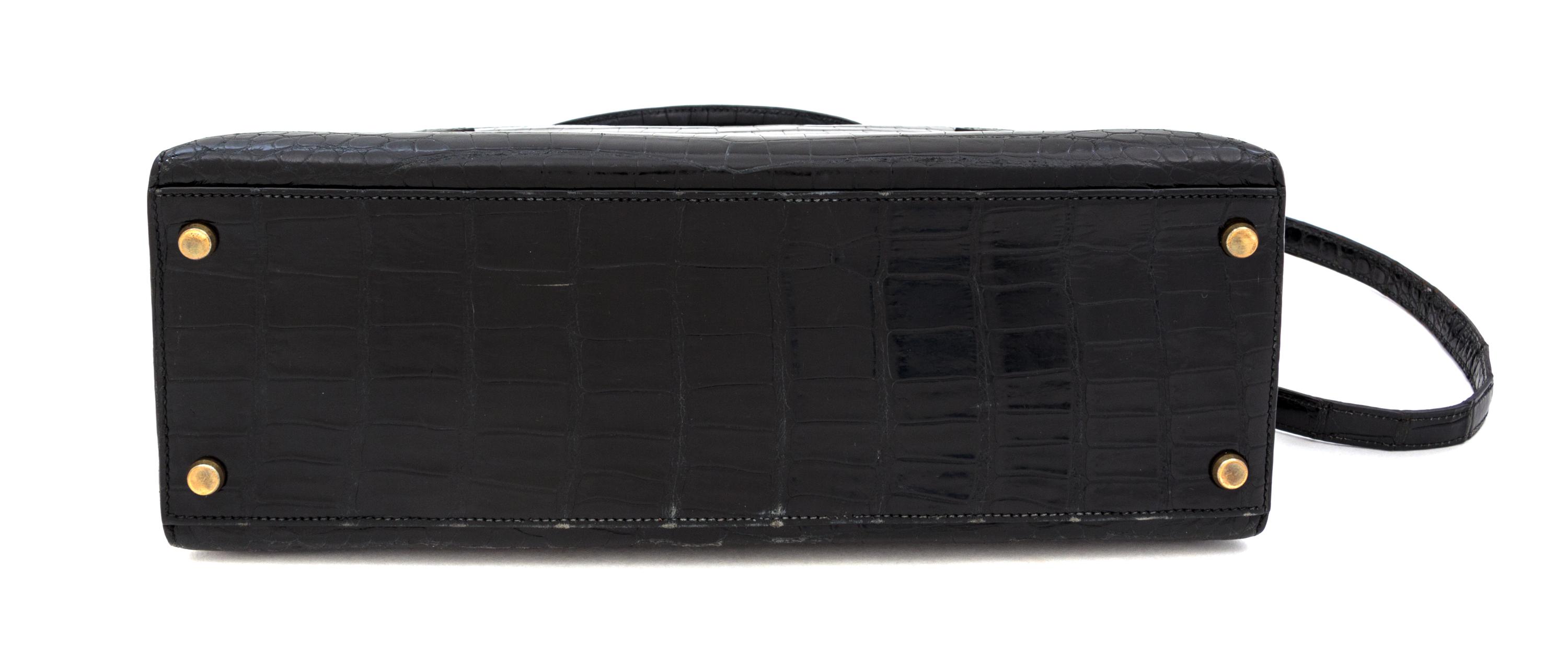 An Hermes 32cm Black Porosus Crocodile Kelly Bag, 12" x 9.5" x 4.5".