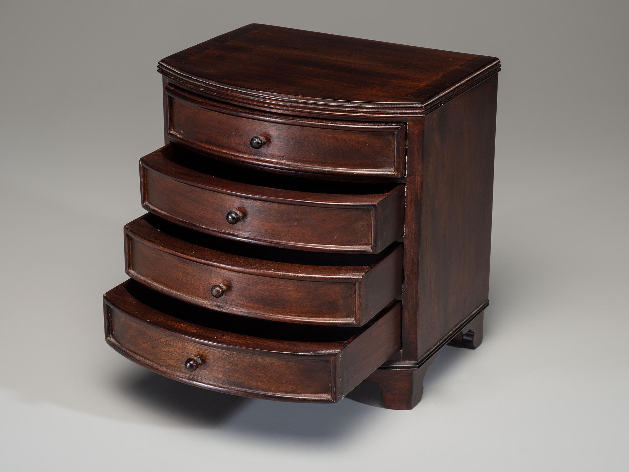 A Miniature Bow Front Chest of Drawers and Drop-Leaf Dining Table