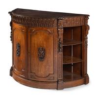 A Continental Carved Oak Demilune Cabinet