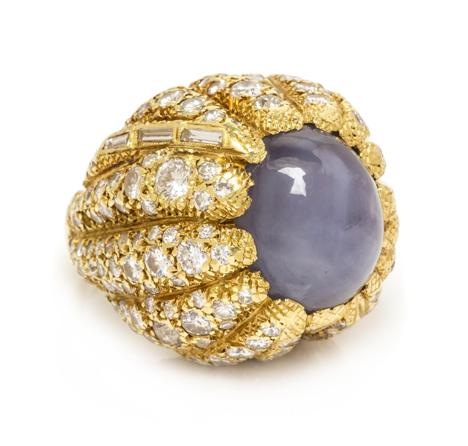 A Yellow Gold, Star Sapphire and Diamond Bombe Ring, 30.40 dwts.